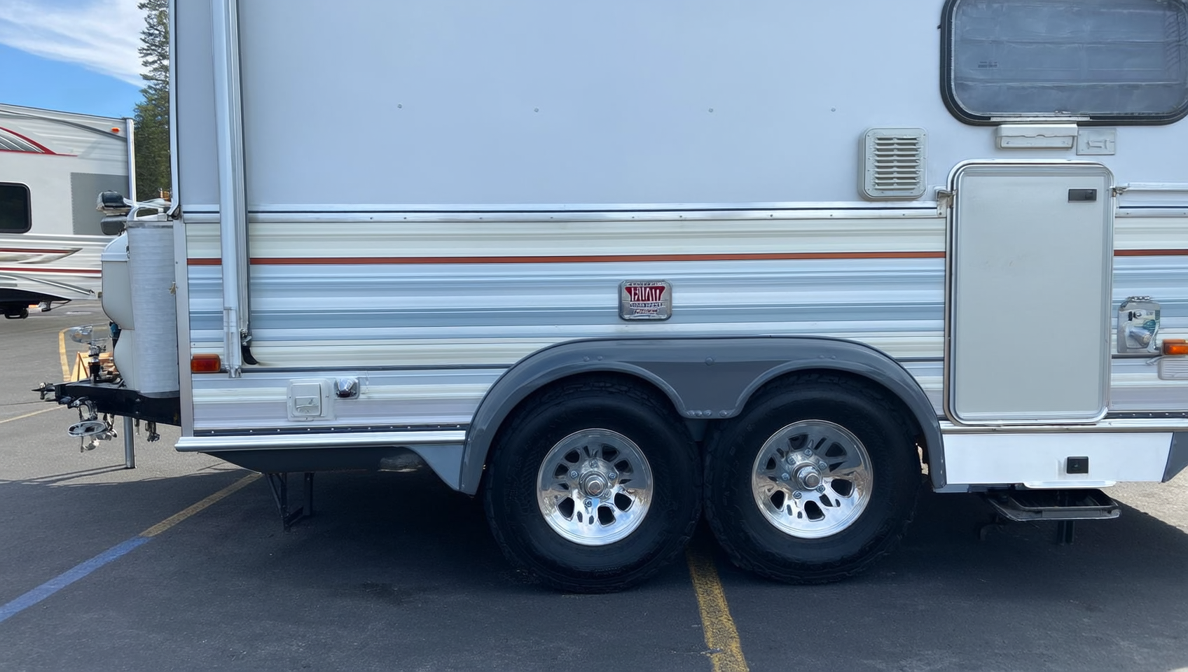Travel trailer with wheel and coupler locks