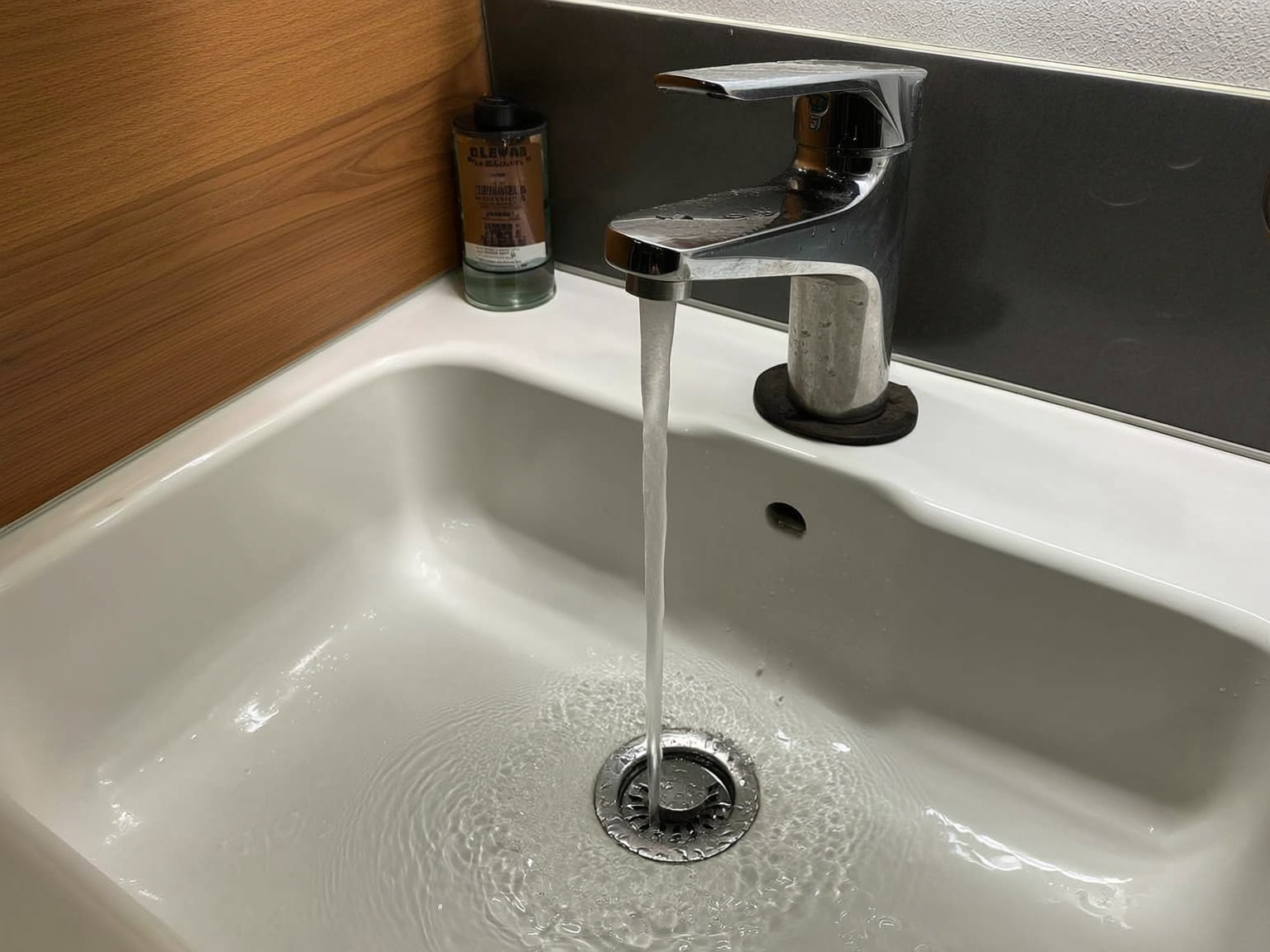 Clean water flowing from RV faucet after proper sanitization